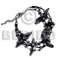 black coco nuggets in metallic silver splashing - Home