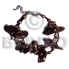 black coco nuggets in metallic bronze splashing - Home