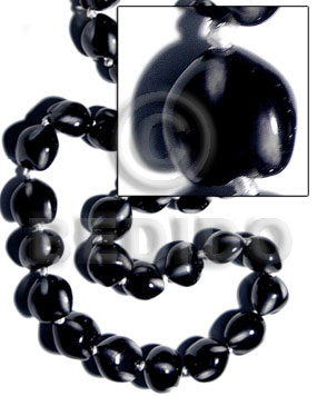 16 pcs. of kukui nuts in high polished paint gloss color in black/white combination / cats eye - Home