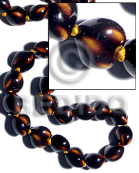 16 pcs. of kukui nuts in high polished paint gloss dark brown/yellow combination  / cats eye - Home