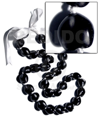 32 pcs. of kukui nuts in high polished paint gloss color in black/white combination in matching adjustable ribbon /lei/ 36in - Home