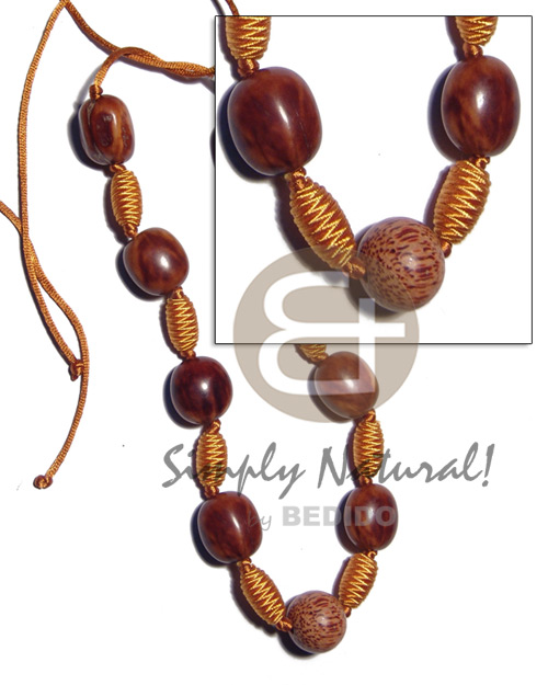 capsule wrapped wood beads  rubber seed, palmwood combination in golden satin cord / 36in adjustable - Home