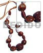 Capsule wrapped wood beads