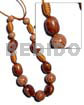 Capsule wrapped wood beads