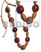 Capsule wrapped wood beads